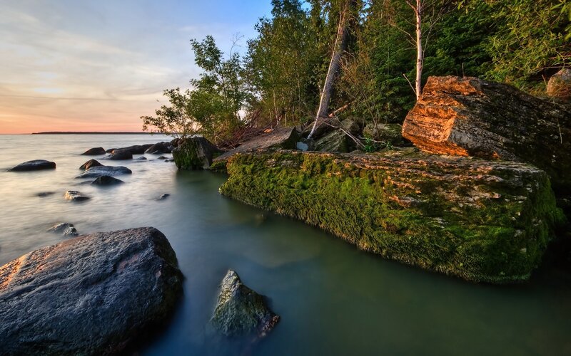 Moss-covered Rocks at Shoreline — Green, Serene