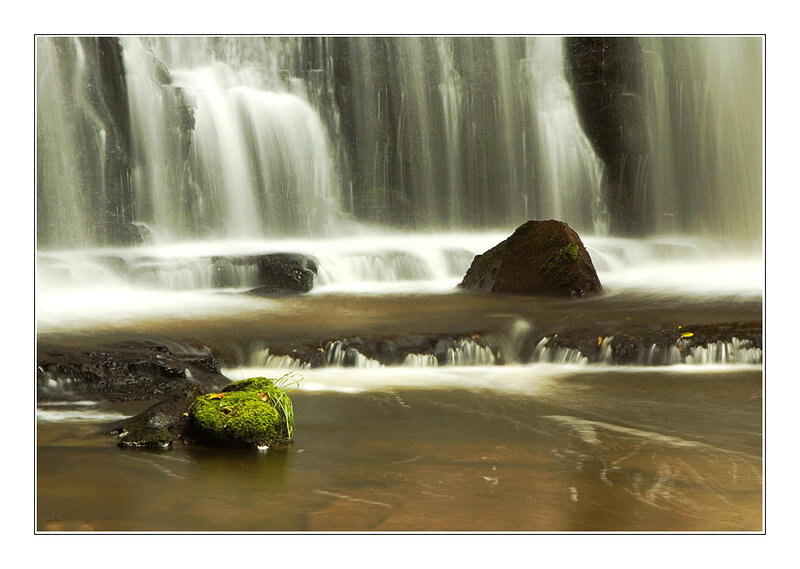 Moss-covered Rocks in Waterfall