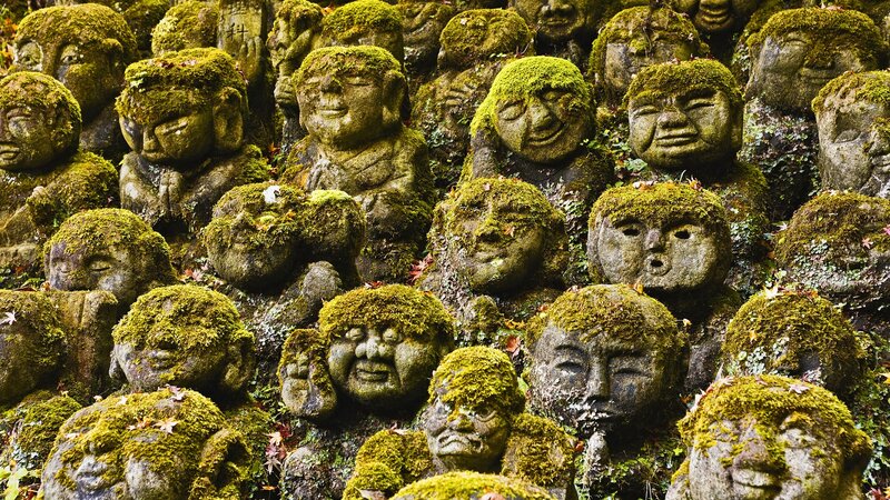 Moss-covered Stone Statues — Green, Serene