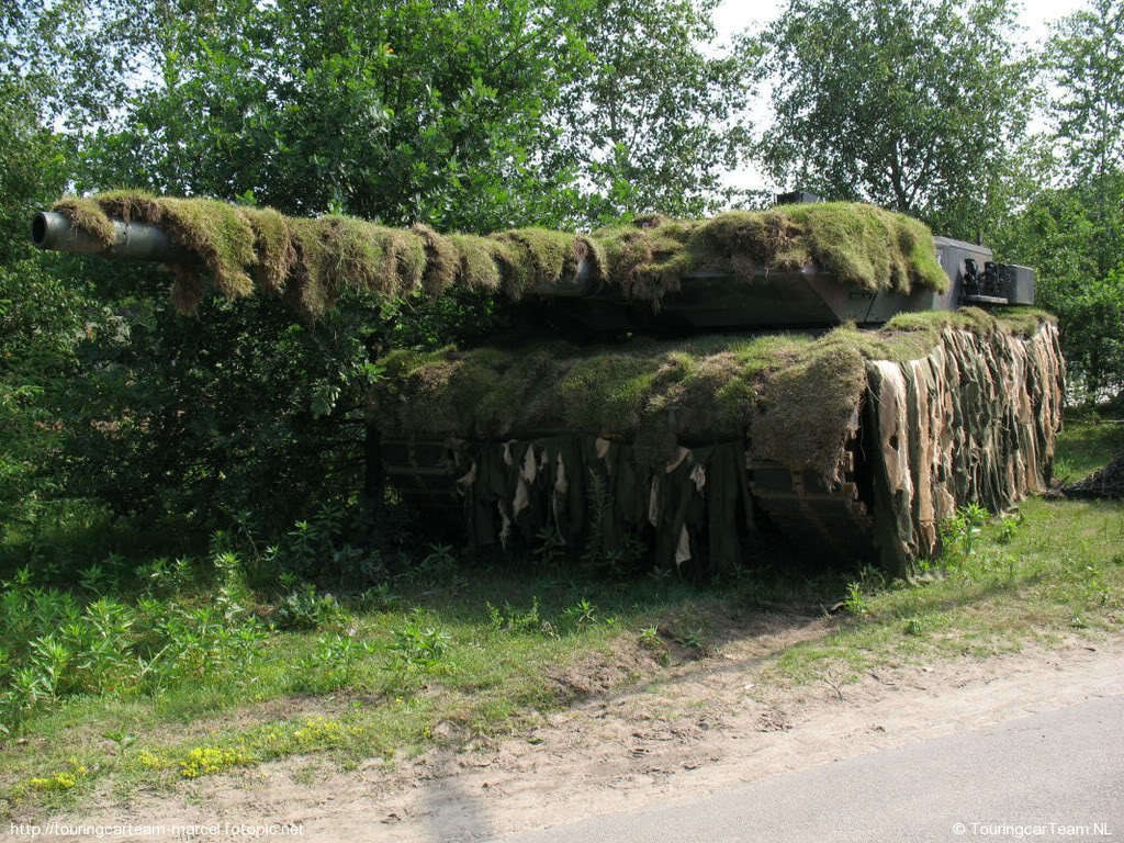 Moss-covered tank in forest