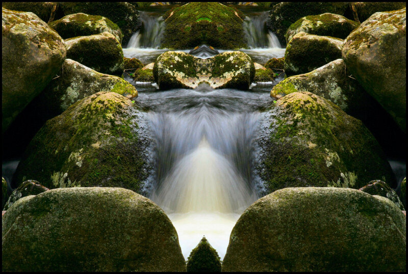 Mossy stream with mirrored waterfall