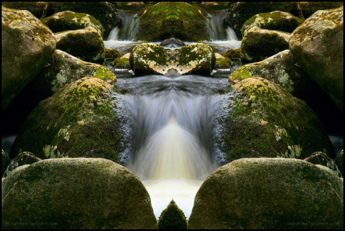 Mossy stream with mirrored waterfall