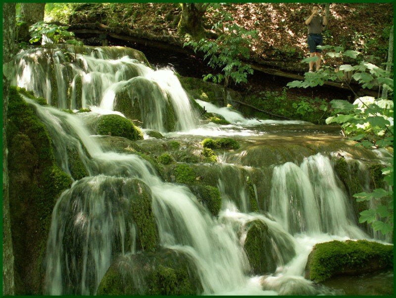 Mossy Waterfall in Forest — Green, Serene, Afternoon, Photograph, Person