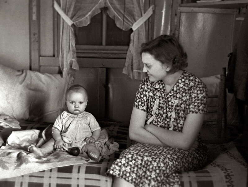 Mother and baby on a bed