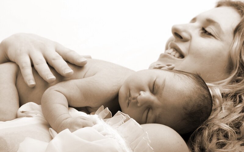 Mother and baby sleeping together