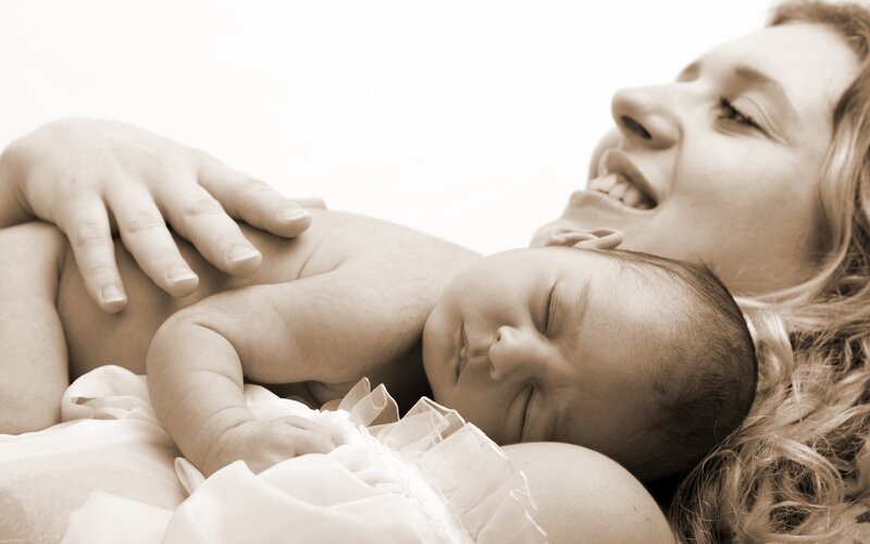 Mother and baby sleeping together