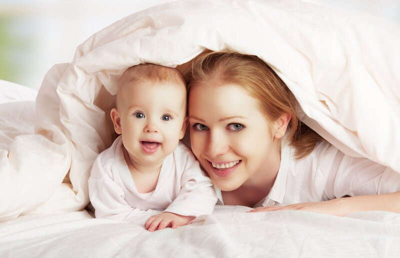 Mother and Baby under Blanket