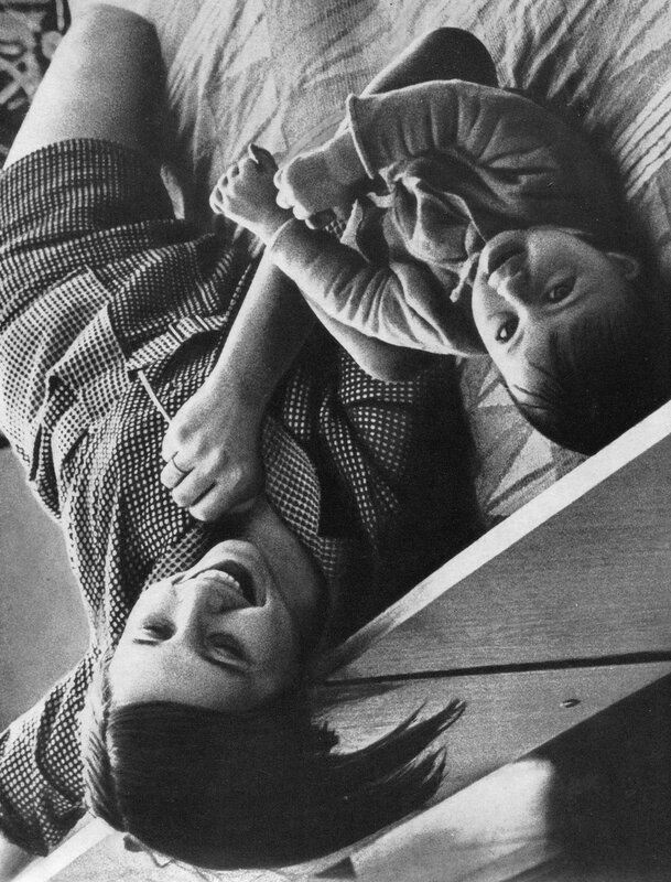 Mother and child lying together