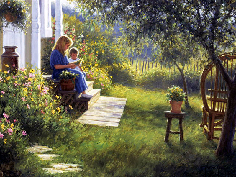 Mother and child reading in garden