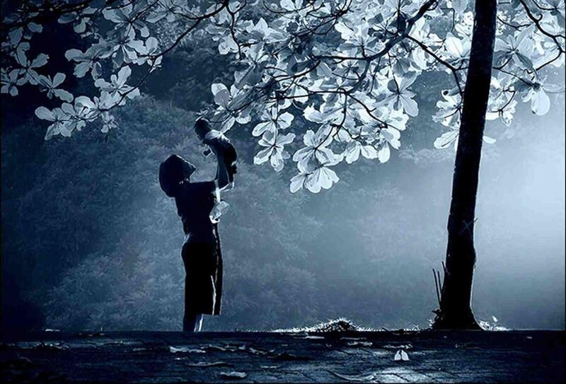 Mother and child under blossoming tree