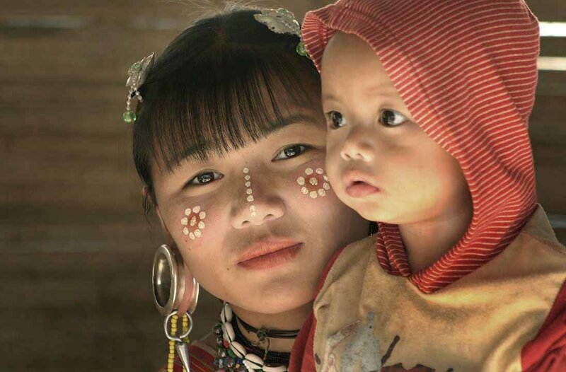 Mother and child with traditional face paint