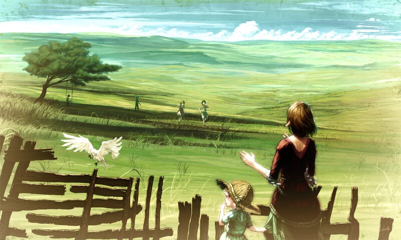 Mother and children in a green field
