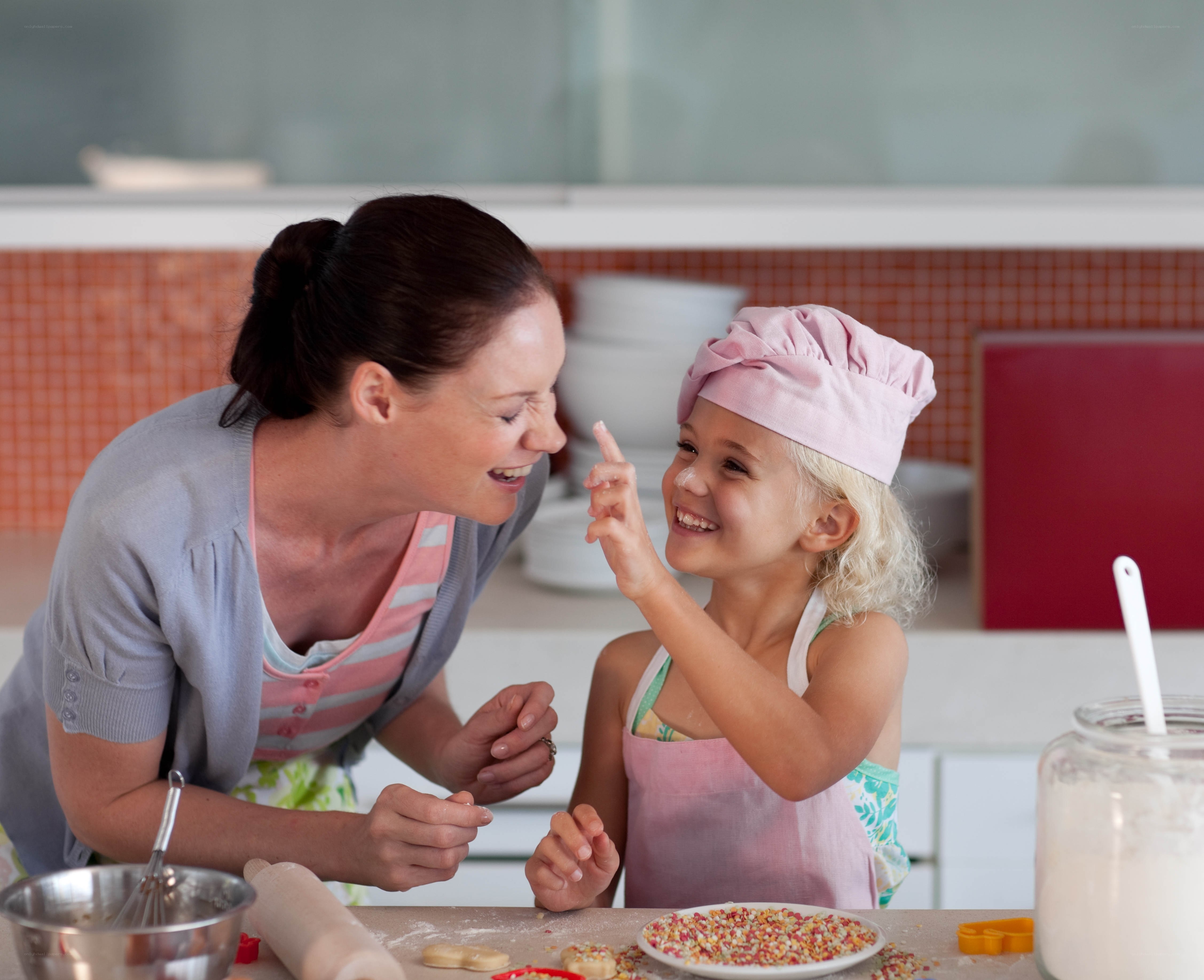 Mother and daughter baking together