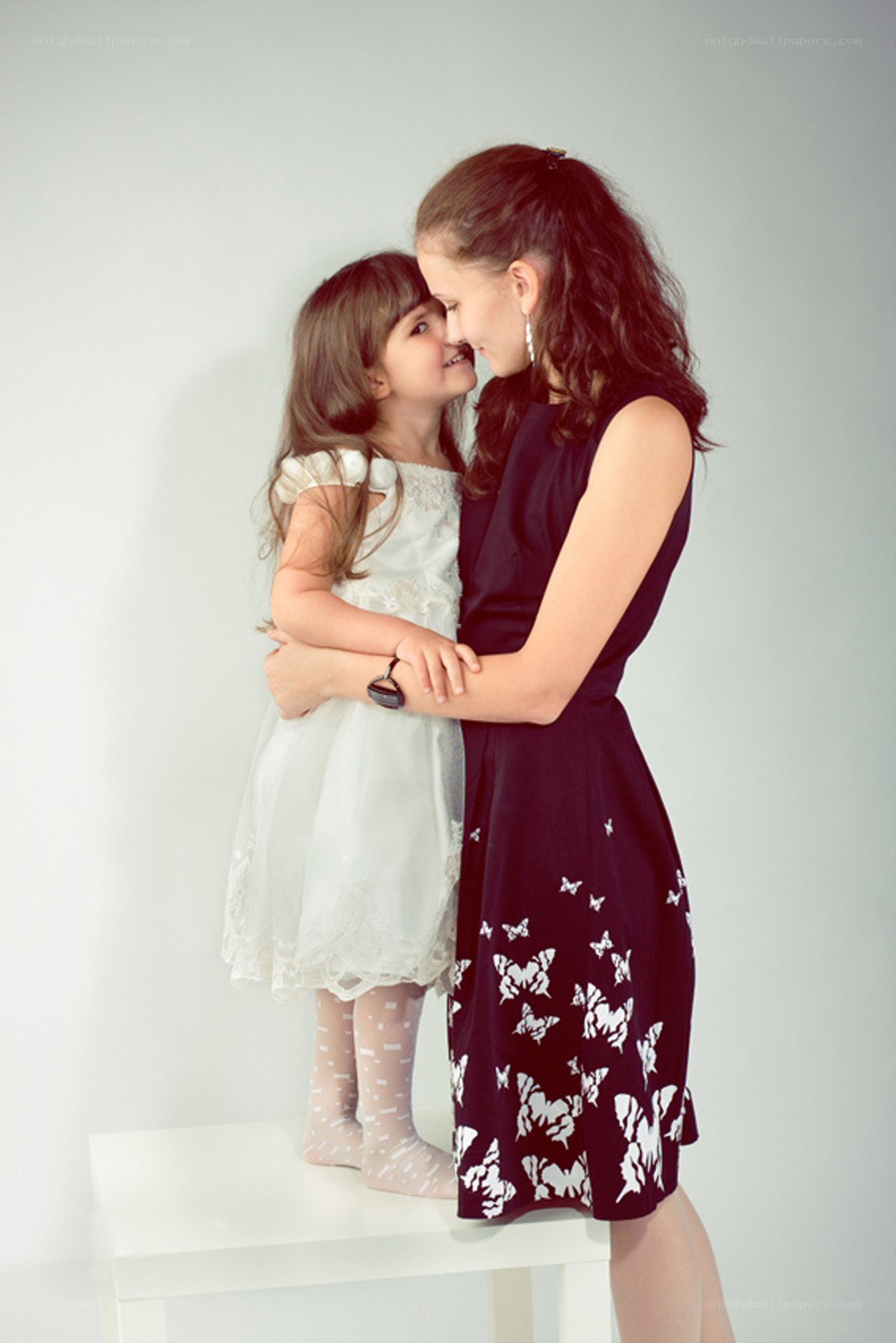 mother and daughter embrace