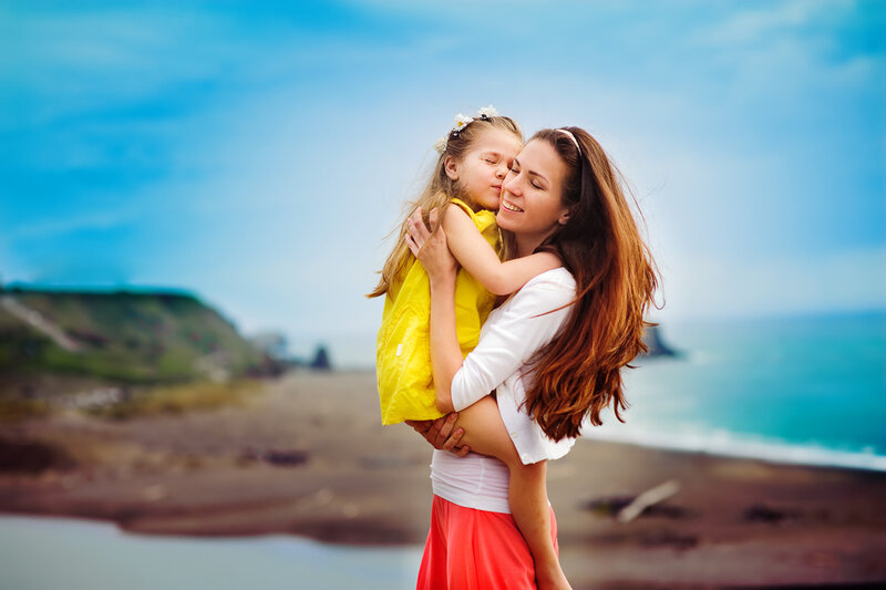 Mother and Daughter Hugging — Blue