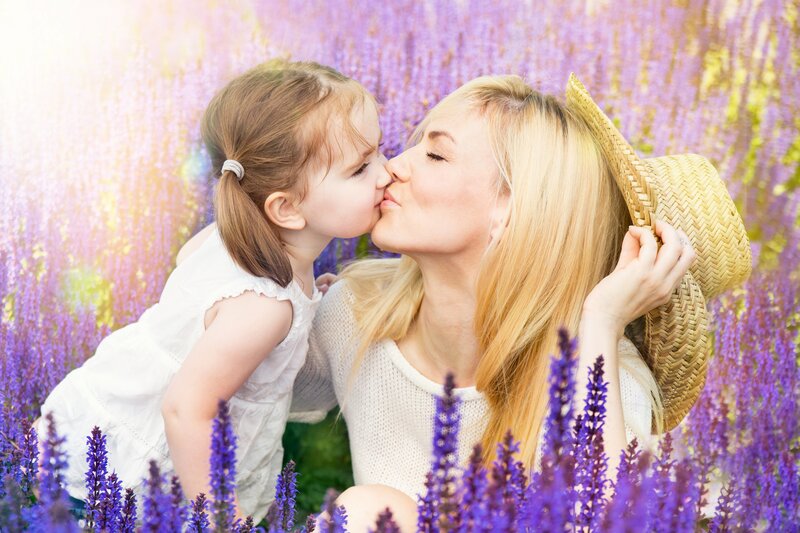 Mother and Daughter Kissing