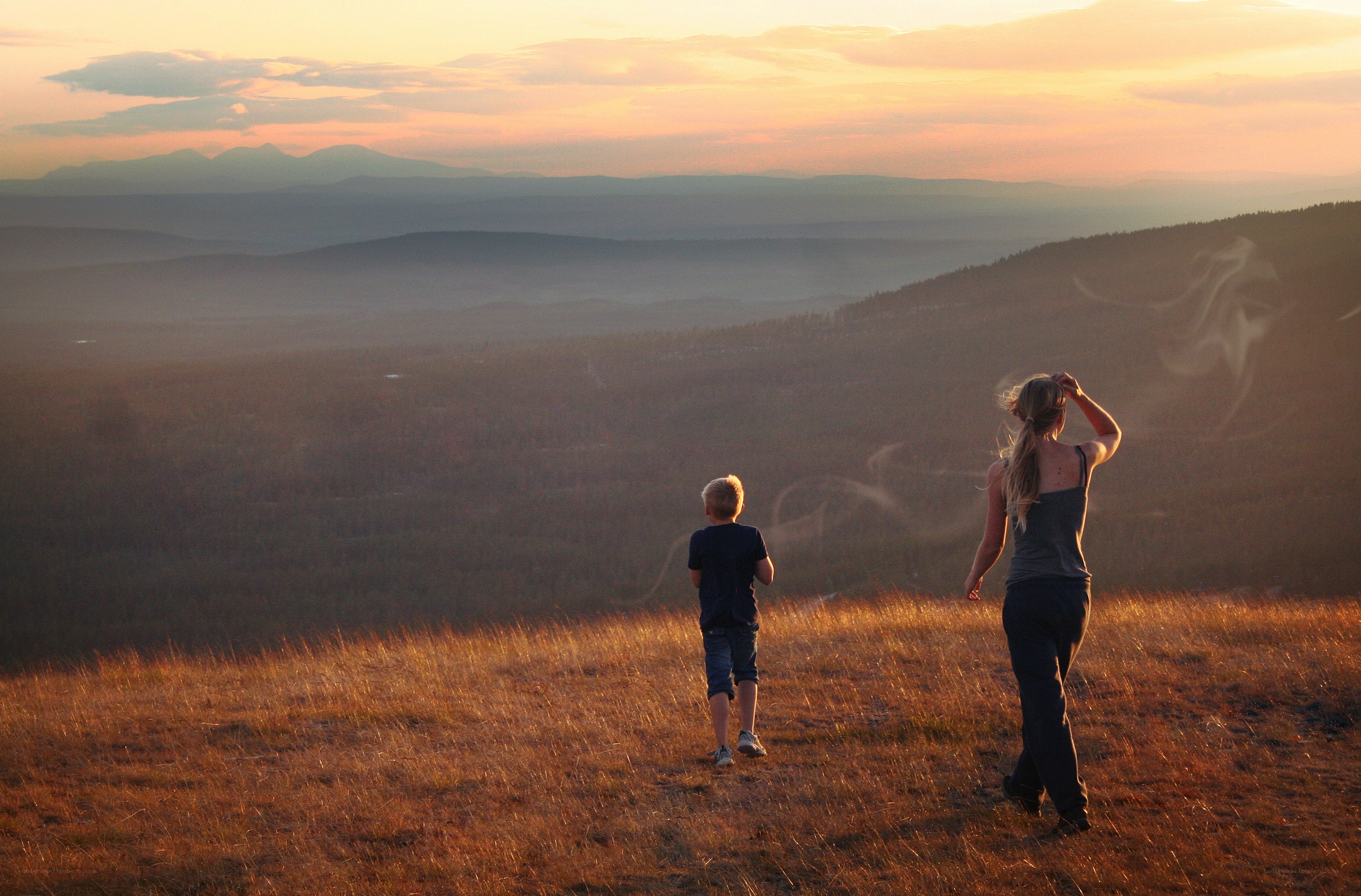 Mother and son at sunset