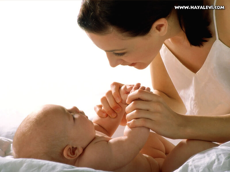 Mother Holding Baby Hands