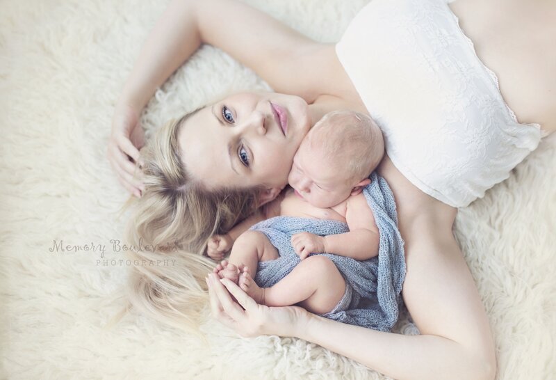 Mother Holding Newborn Baby — White