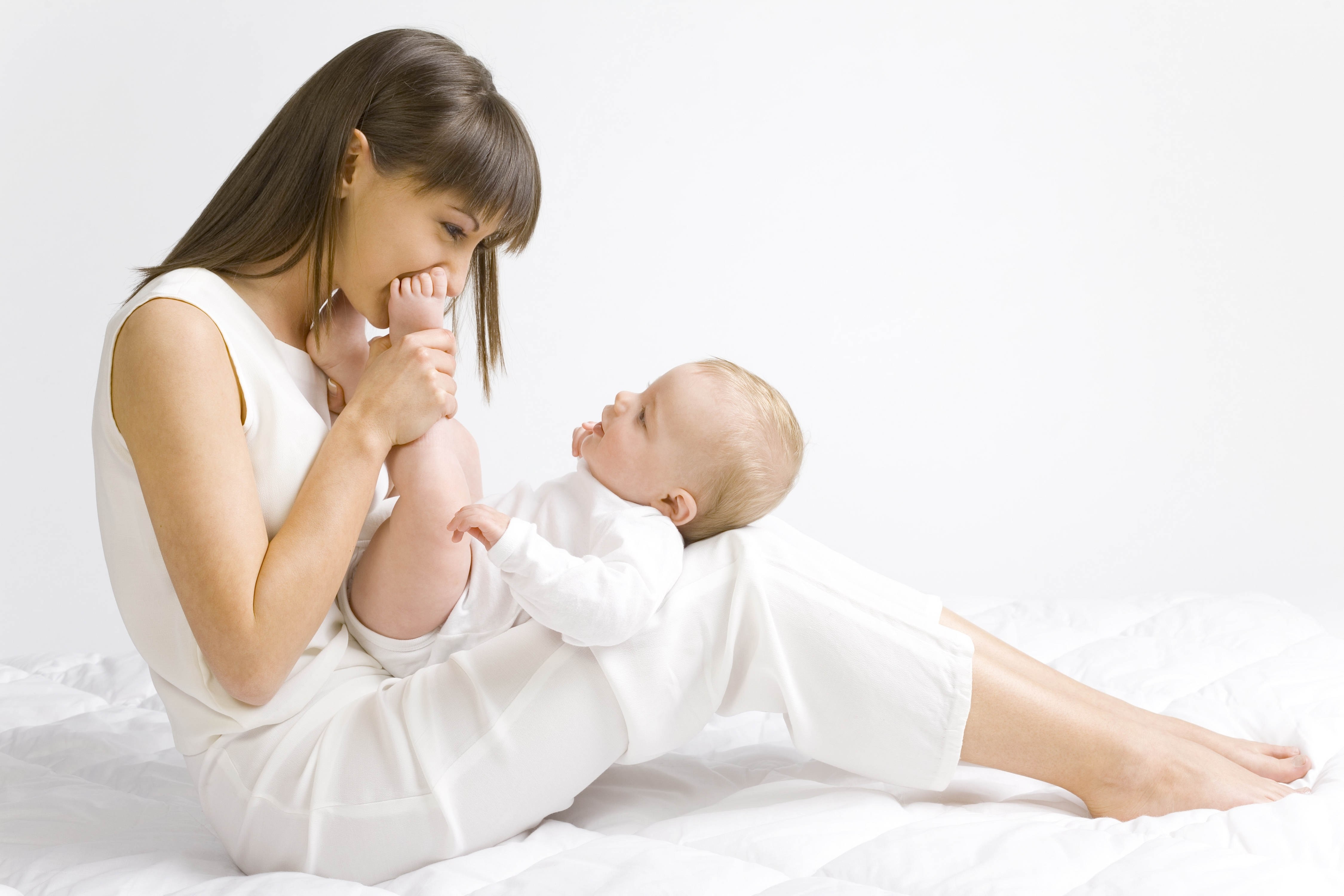 Mother playing with baby