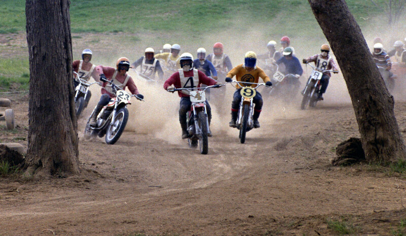 Motocross racers on dirt track