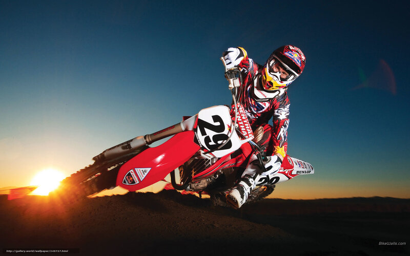 Motocross rider at sunset