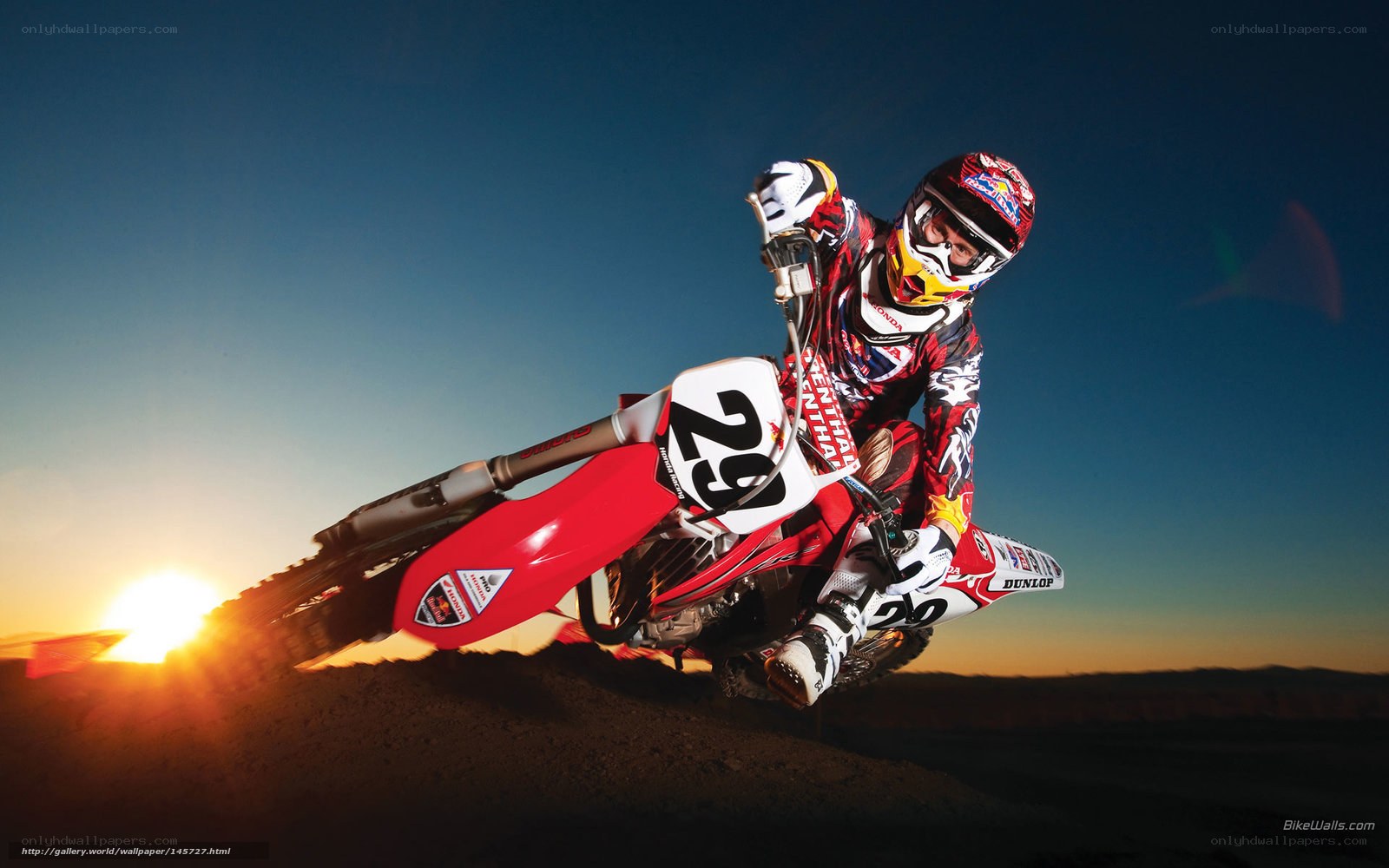 Motocross rider at sunset
