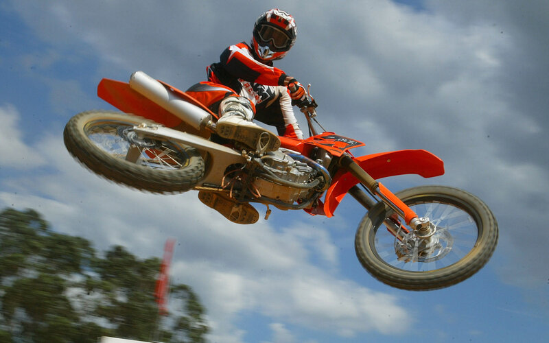 Motocross rider in mid-air jump