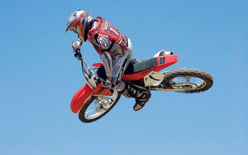 Motocross rider in mid-air jump
