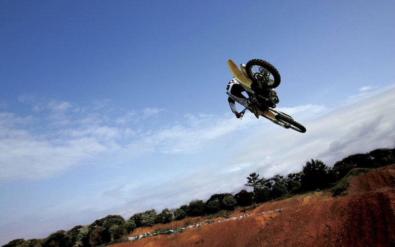 Motocross rider in mid-air jump