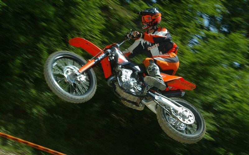 Motocross rider in mid-air jump