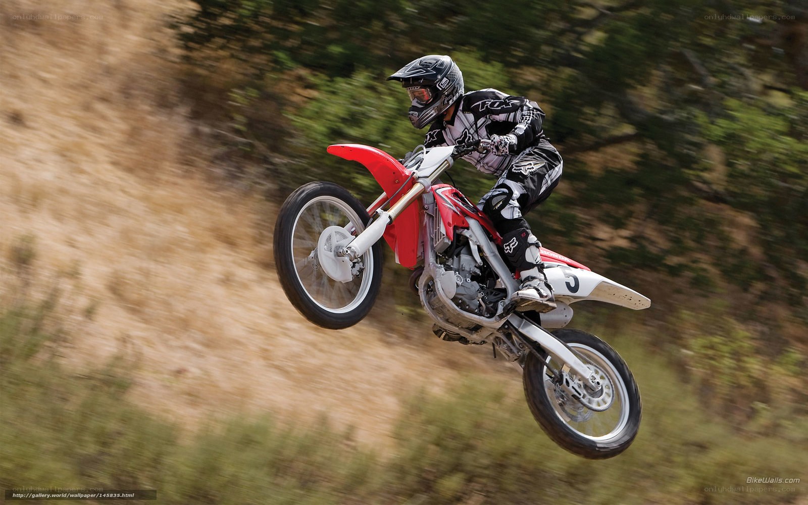 Motocross rider in mid-air jump