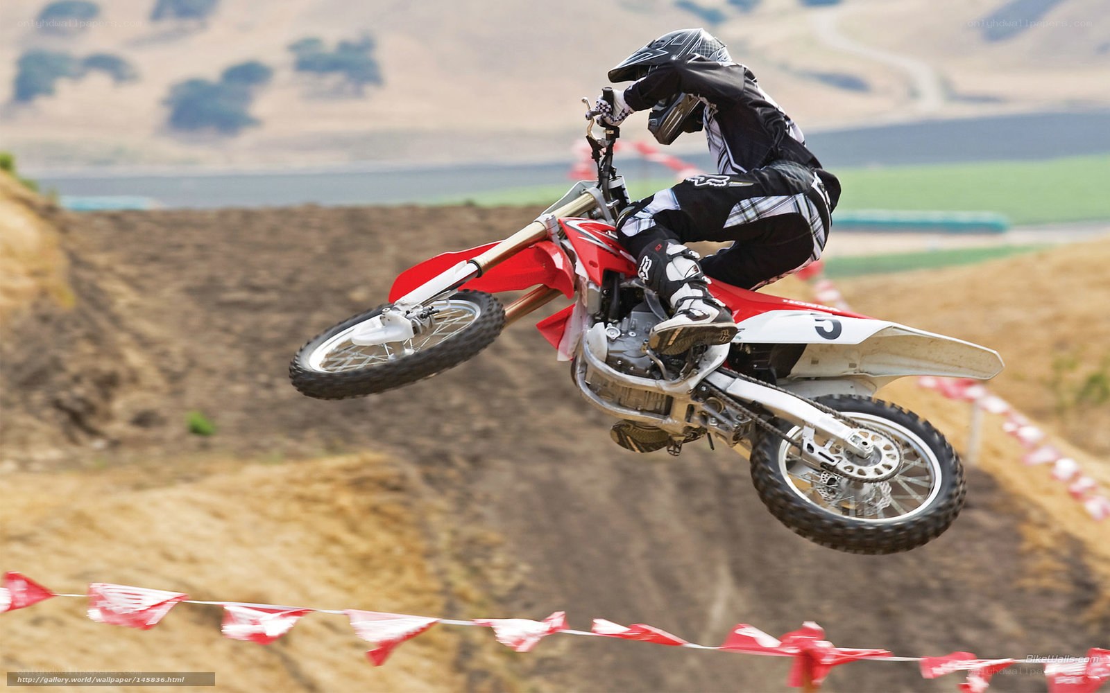 Motocross rider in mid-air jump