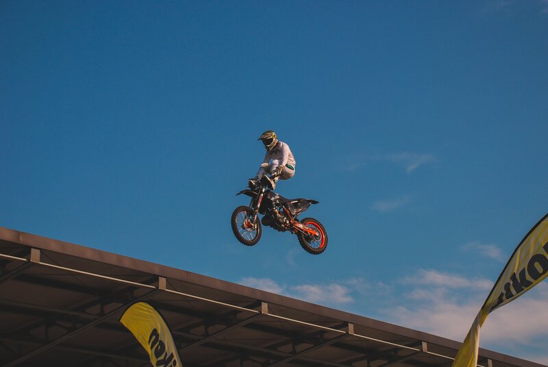 Motocross rider in mid-air jump