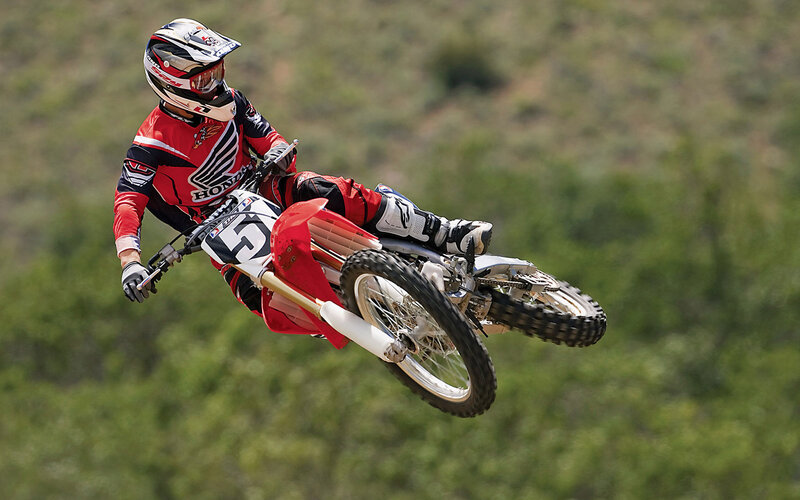 Motocross Rider in Mid-air — Red
