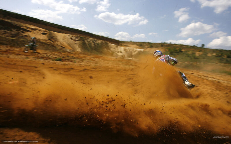 Motocross rider kicking up dust