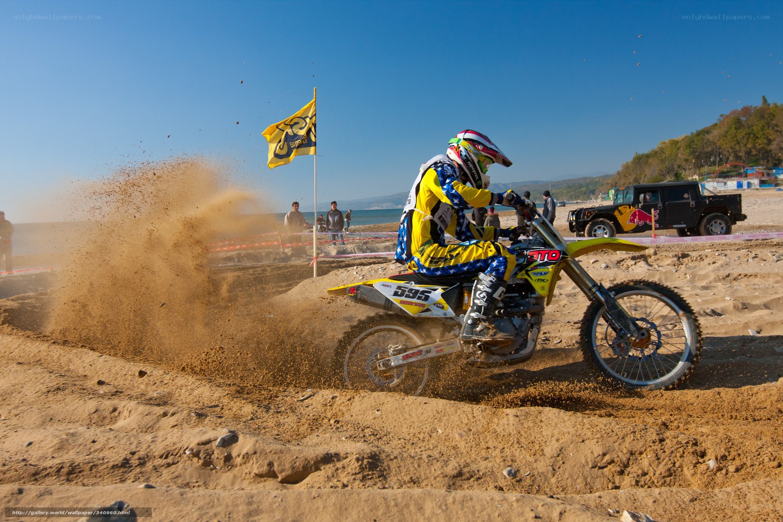 Motocross rider on beach track
