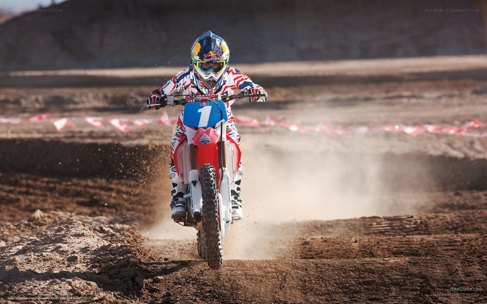 Motocross rider on dirt track