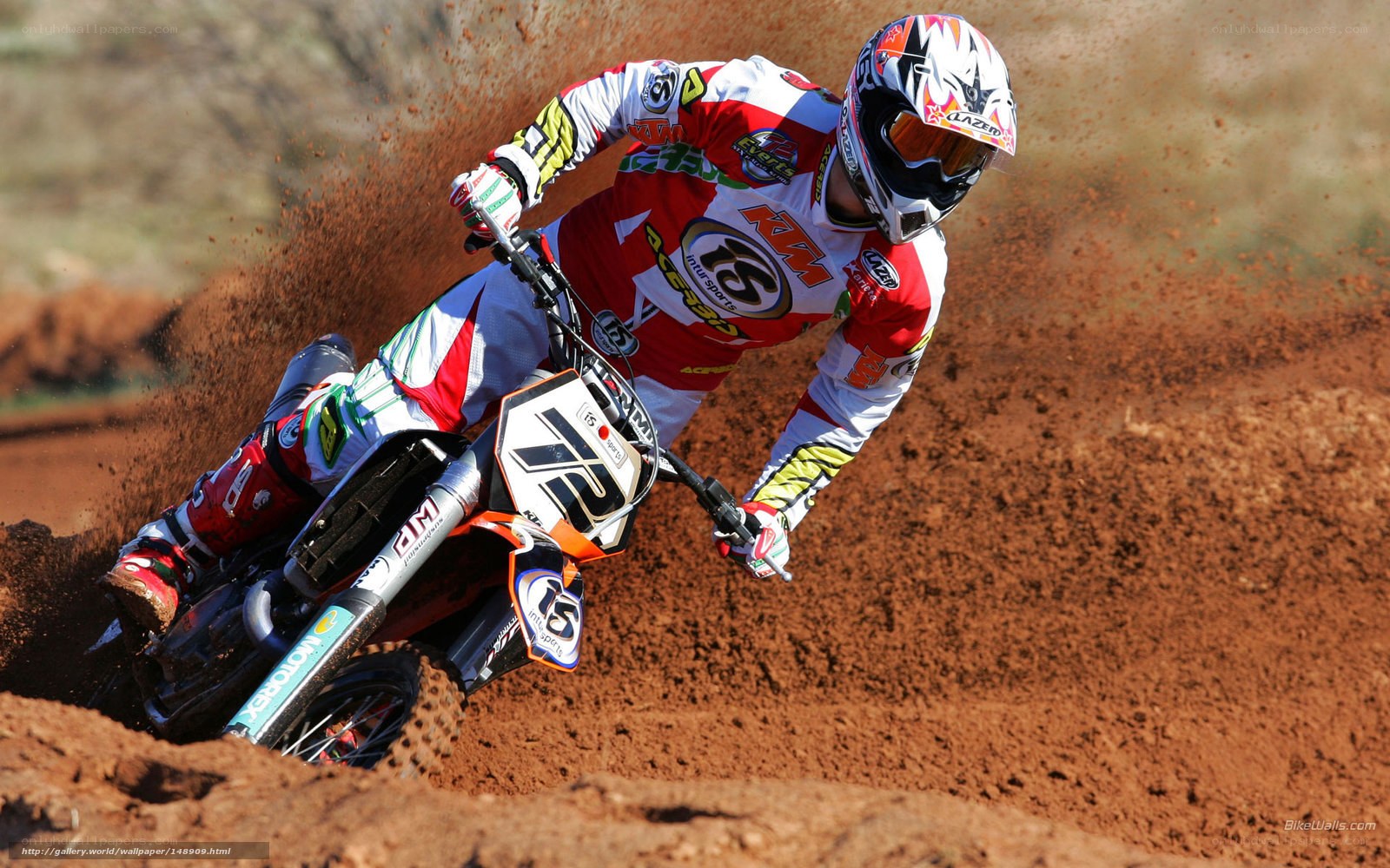 Motocross rider on dirt track