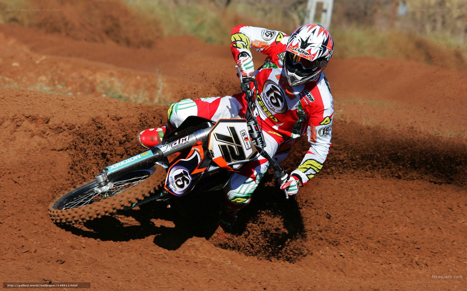 Motocross rider on dirt track