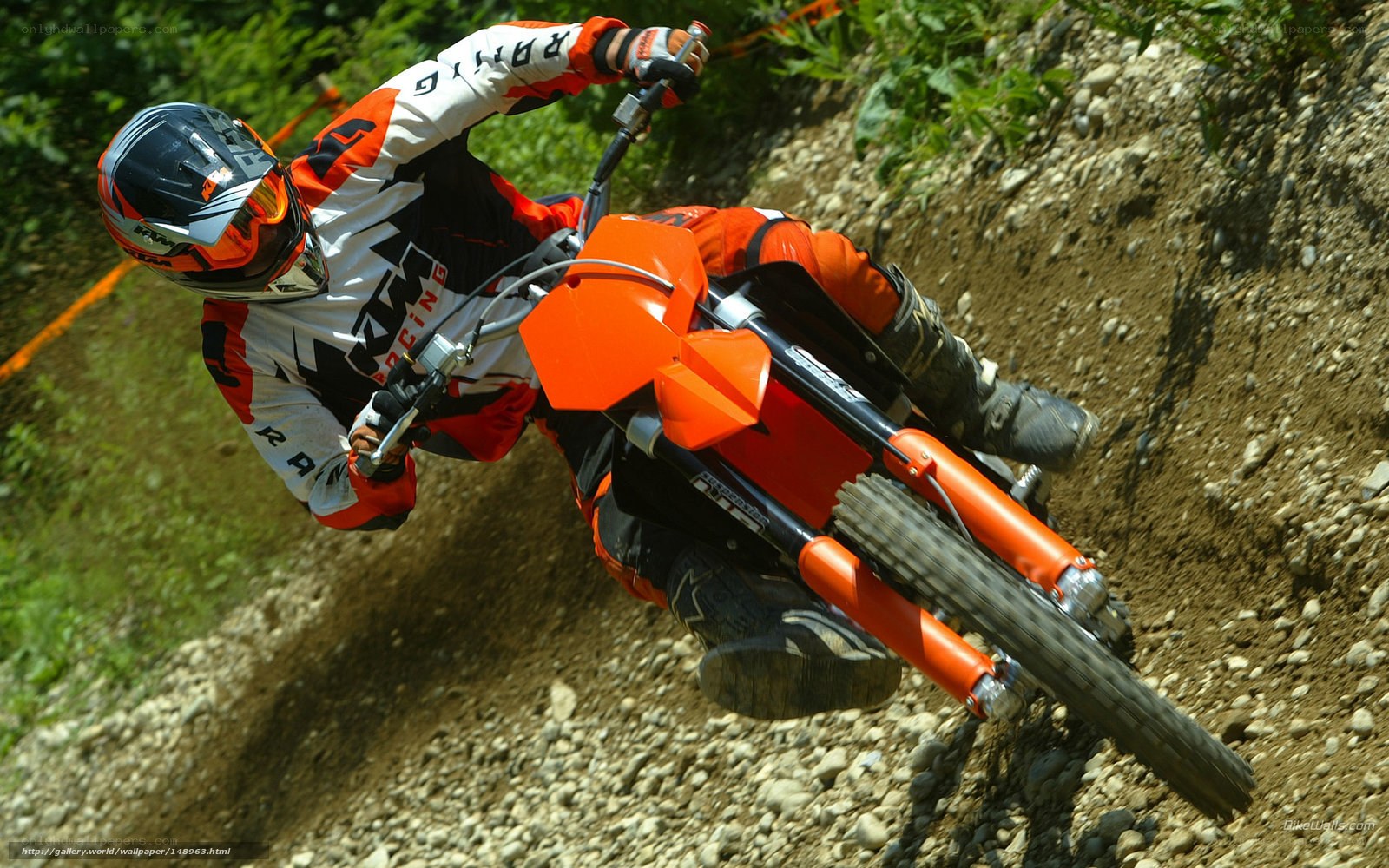 Motocross rider on dirt track