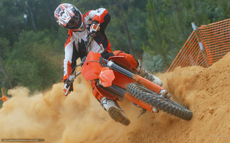 Motocross rider on dirt track