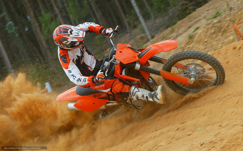 Motocross rider on dirt track