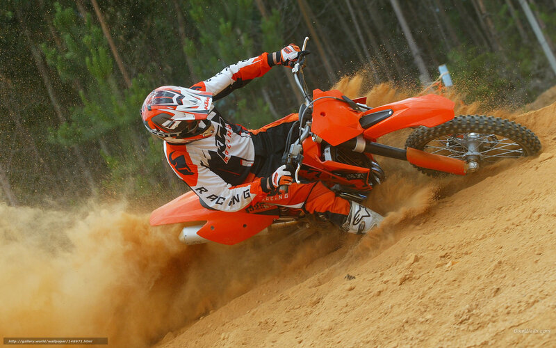 Motocross rider on dirt track