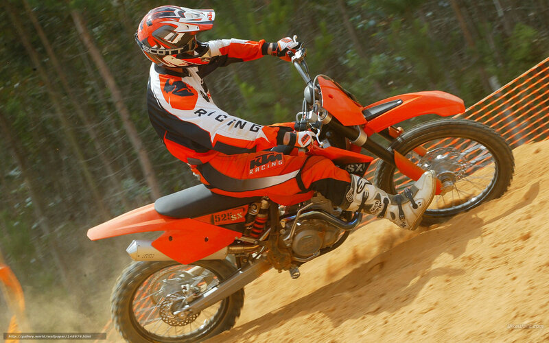 Motocross rider on dirt track