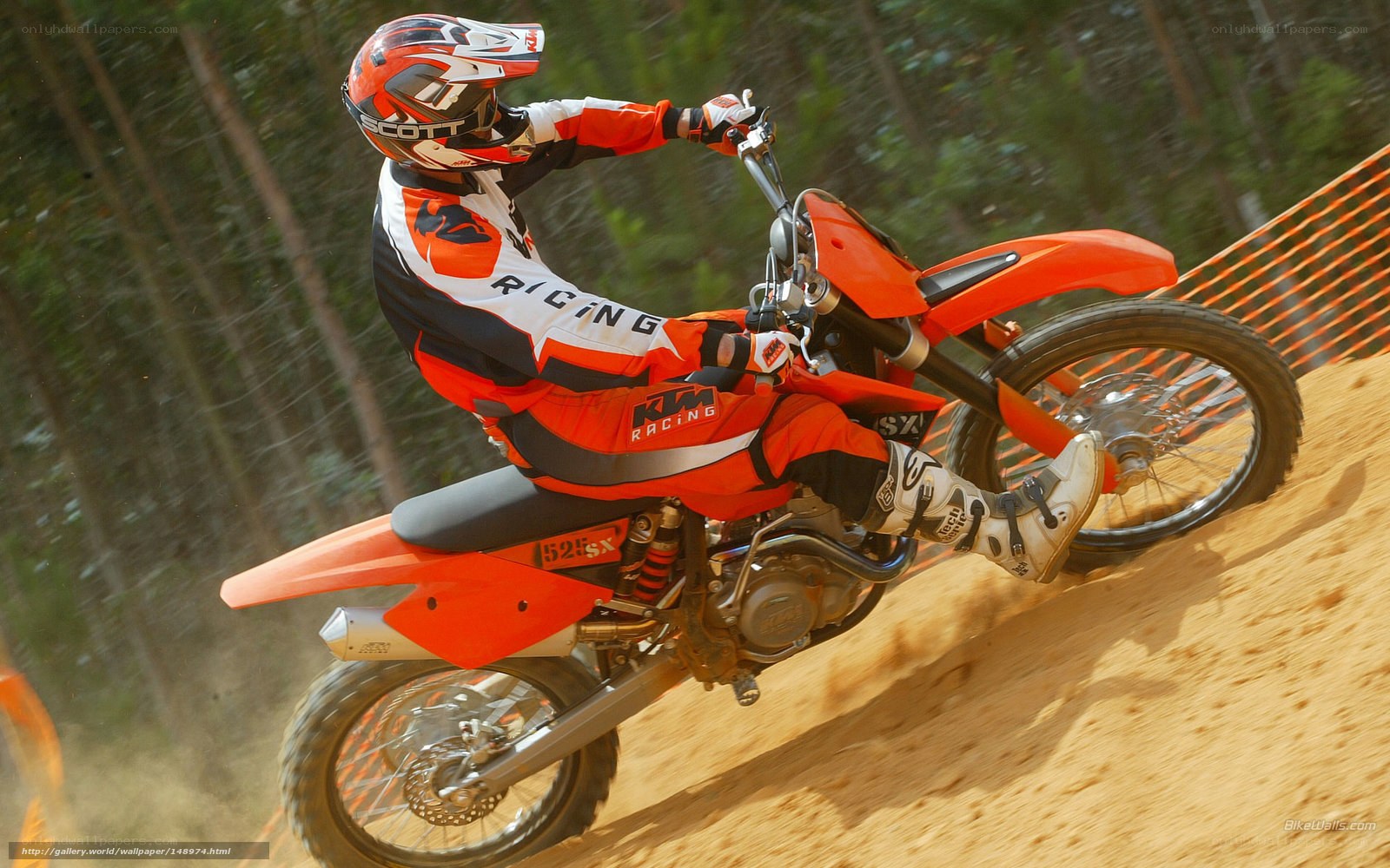 Motocross rider on dirt track