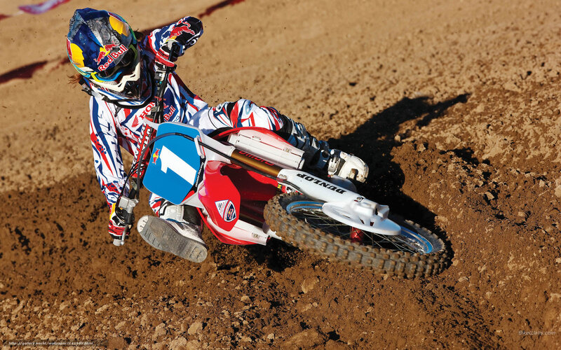 Motocross rider on dirt track