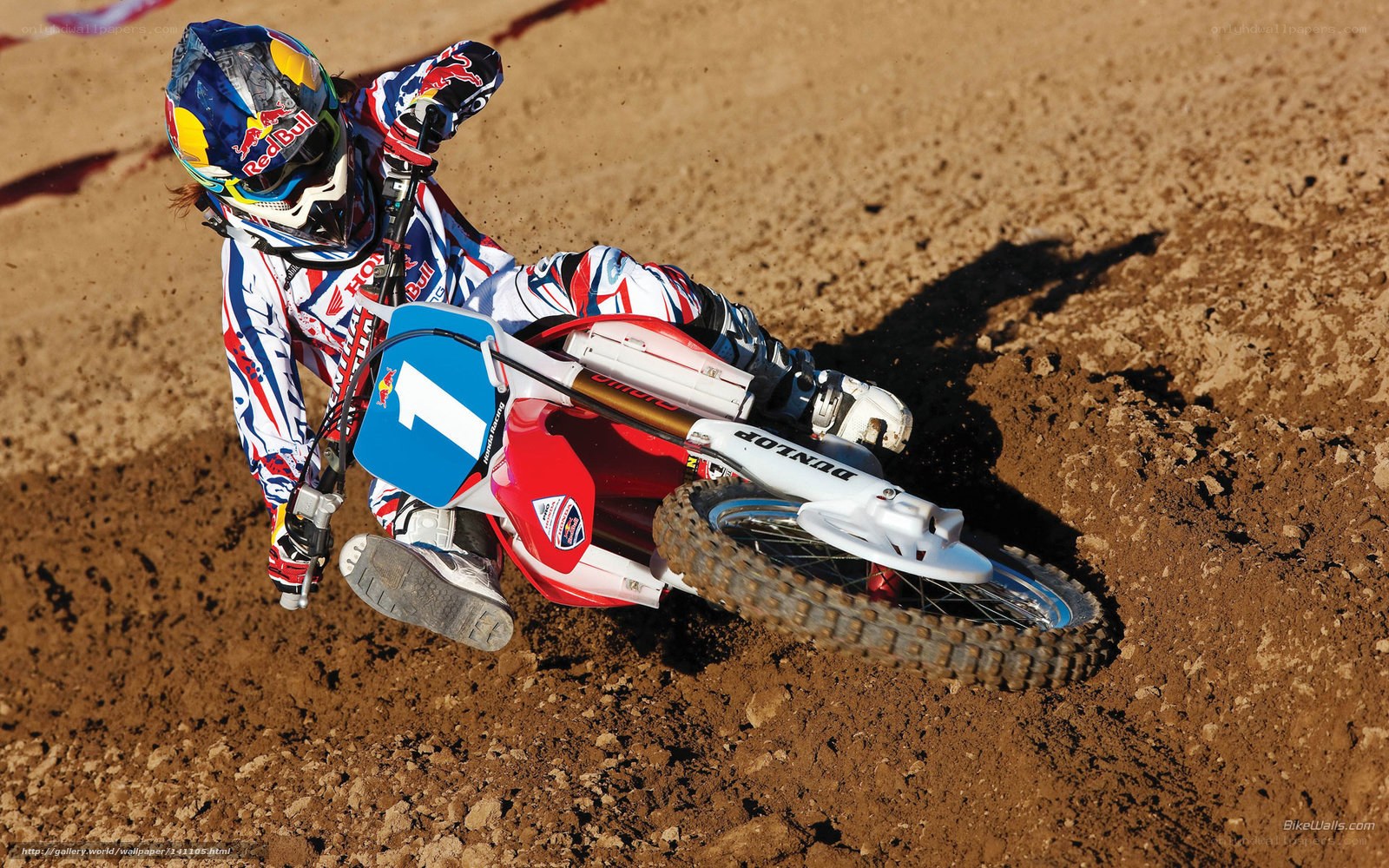 Motocross rider on dirt track