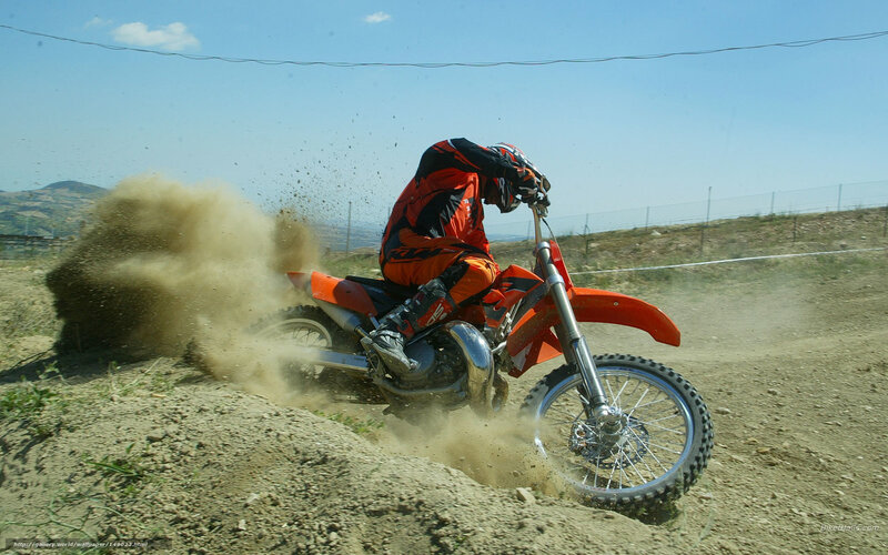 Motocross rider on dirt track