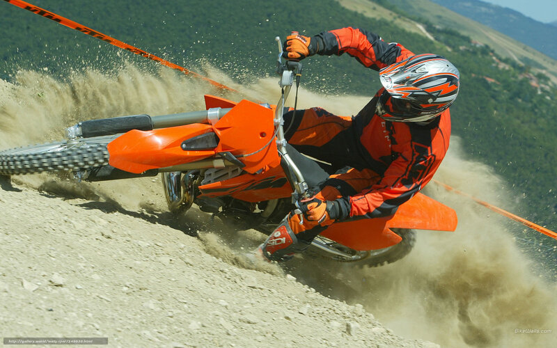 Motocross rider on dirt track